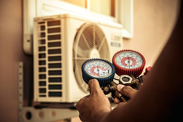 Professional Heat Pump Repair technician working in Mattituck, NY